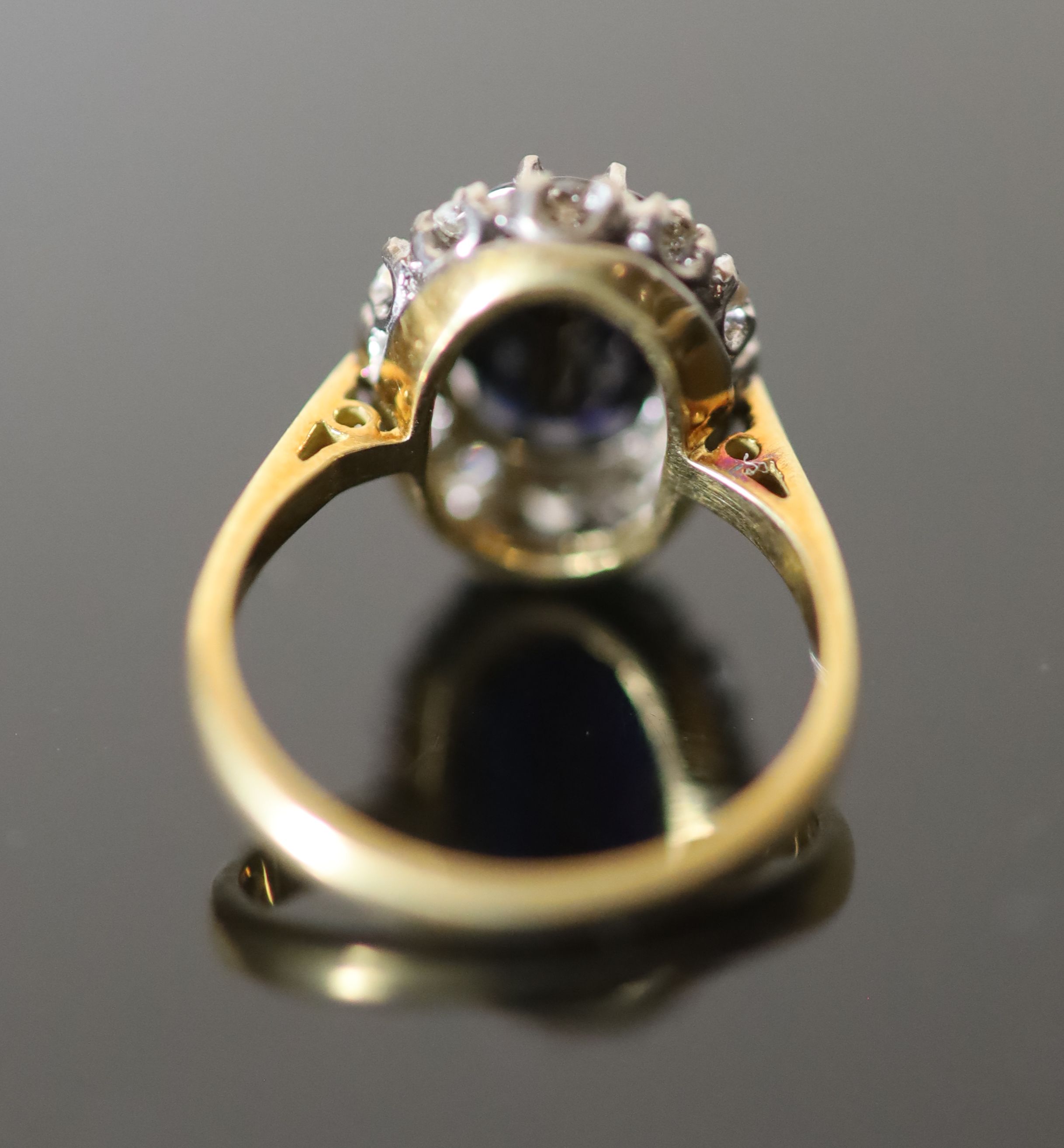 A 20th century 18ct gold, sapphire and diamond set oval cluster ring,